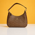 Hobo teri brown sling bag with box